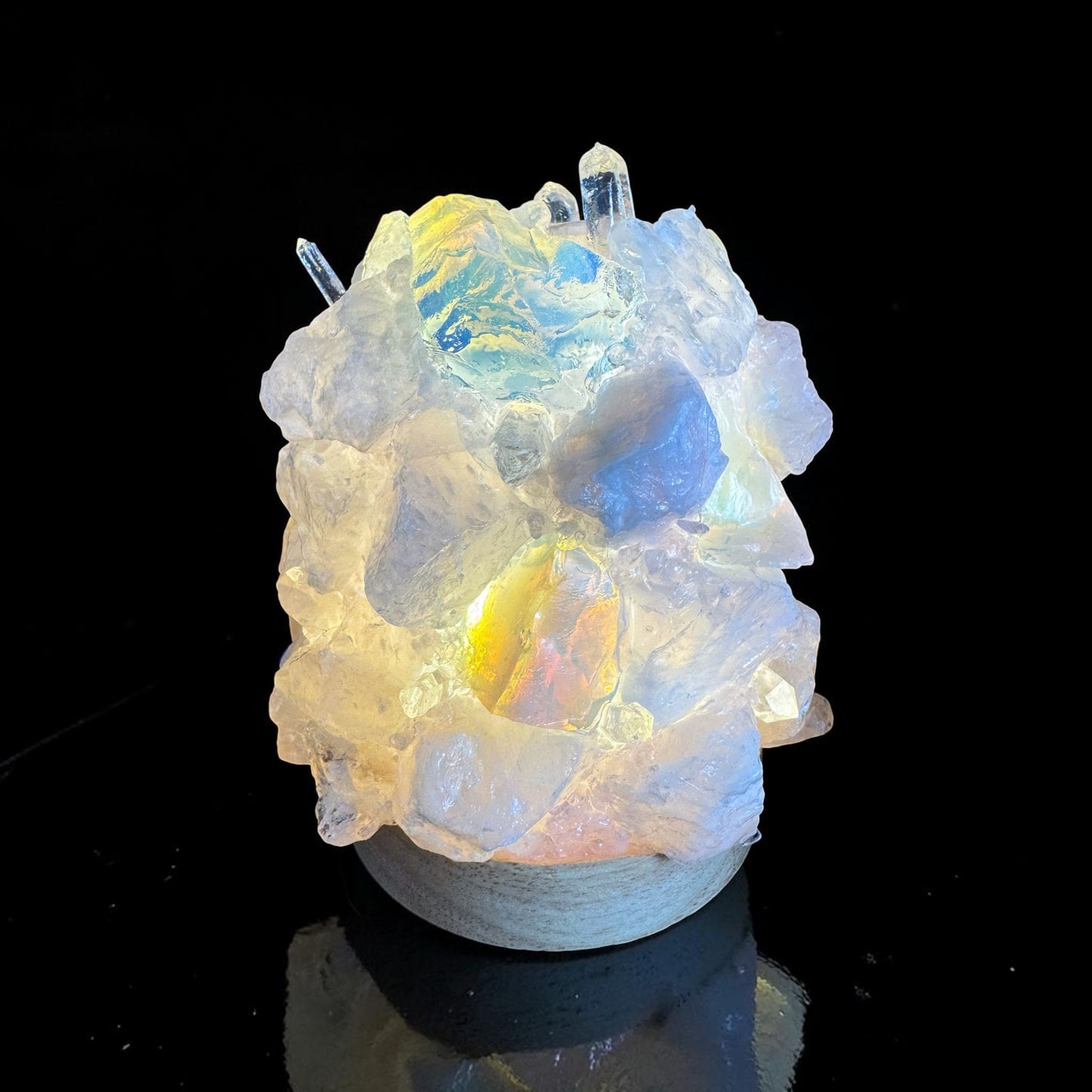 Rose quartz opalite crystal dome lamp glowing in varied colors, handcrafted with natural crystals.