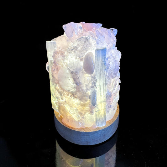 Rose Quartz & Selenite dome lamp with a handcrafted design, illuminating colorful crystals for a calming glow.