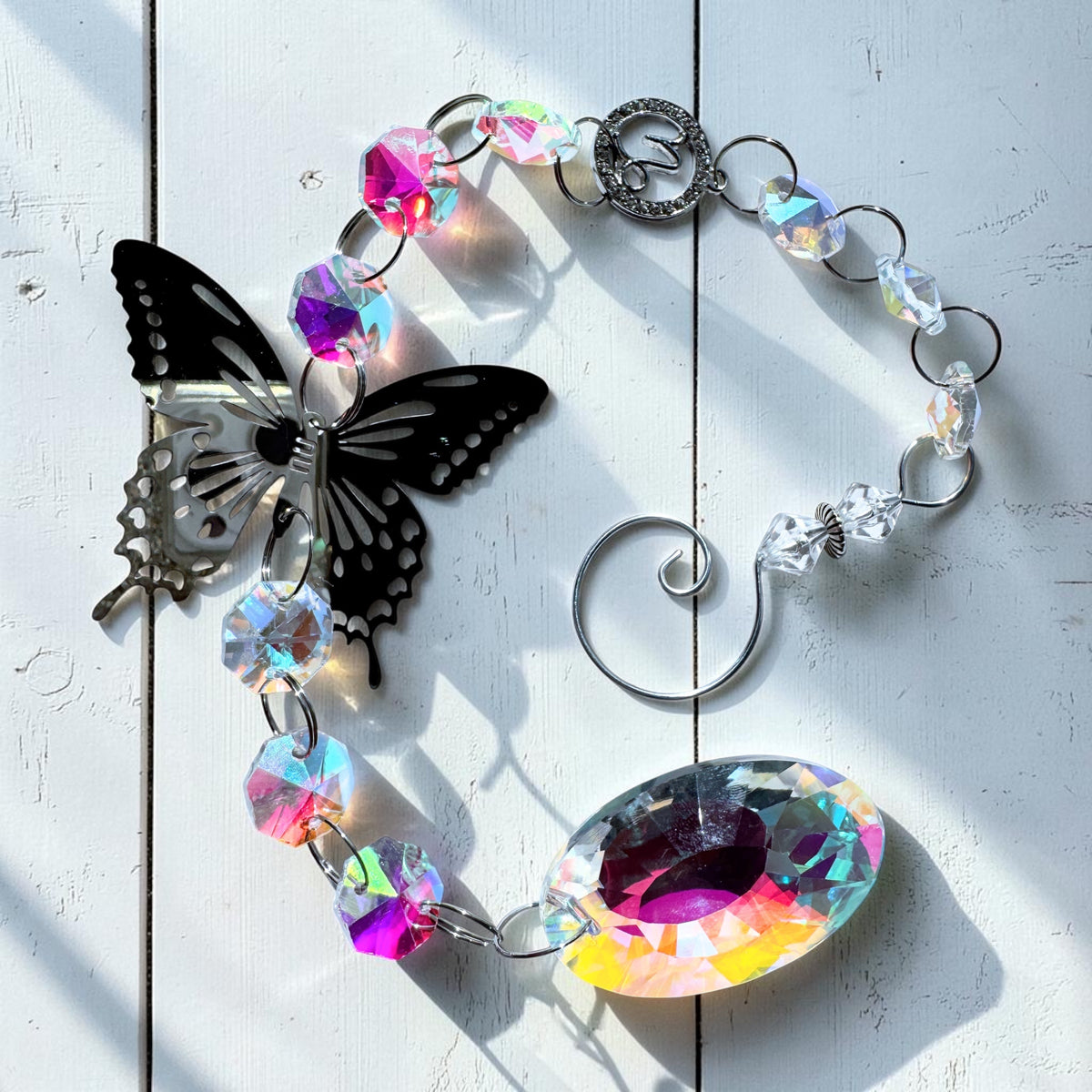 Butterfly Star Sign Sun Catcher with iridescent glass and metal details, perfect for adding charm and light to your decor.