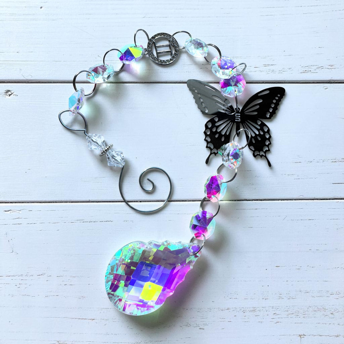 Butterfly Star Sign Sun Catcher featuring iridescent glass and silver butterfly design, perfect for home decor.