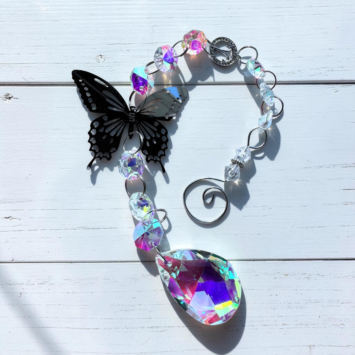 Butterfly Star Sign Sun Catcher with iridescent glass and silver metal butterfly for home decor.