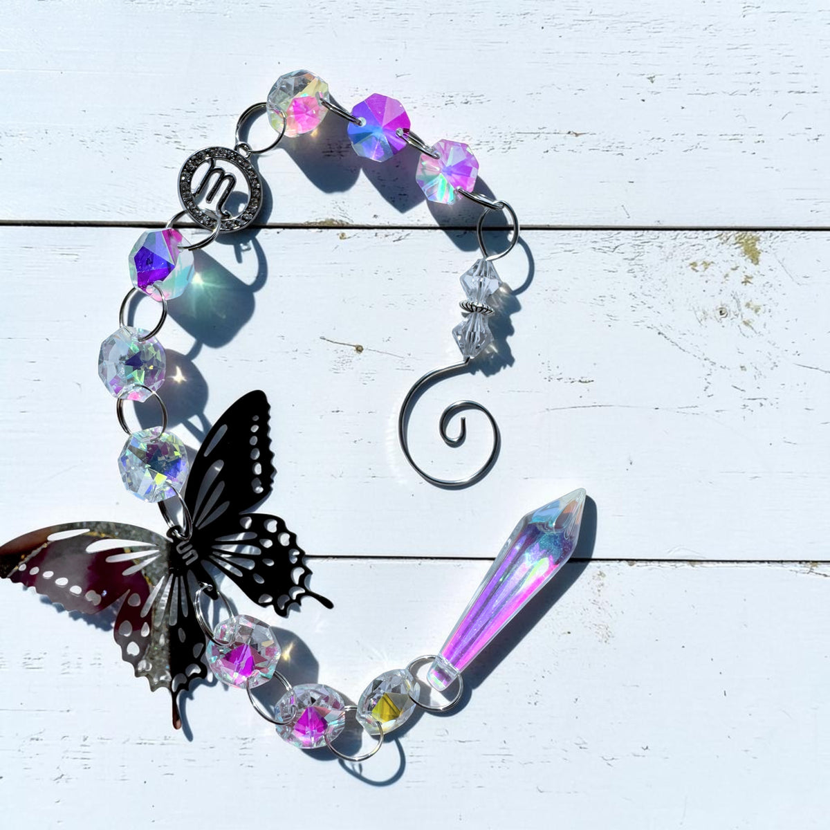 Beautiful Butterfly Star Sign Sun Catcher with iridescent beads and metal butterfly, perfect for home décor.