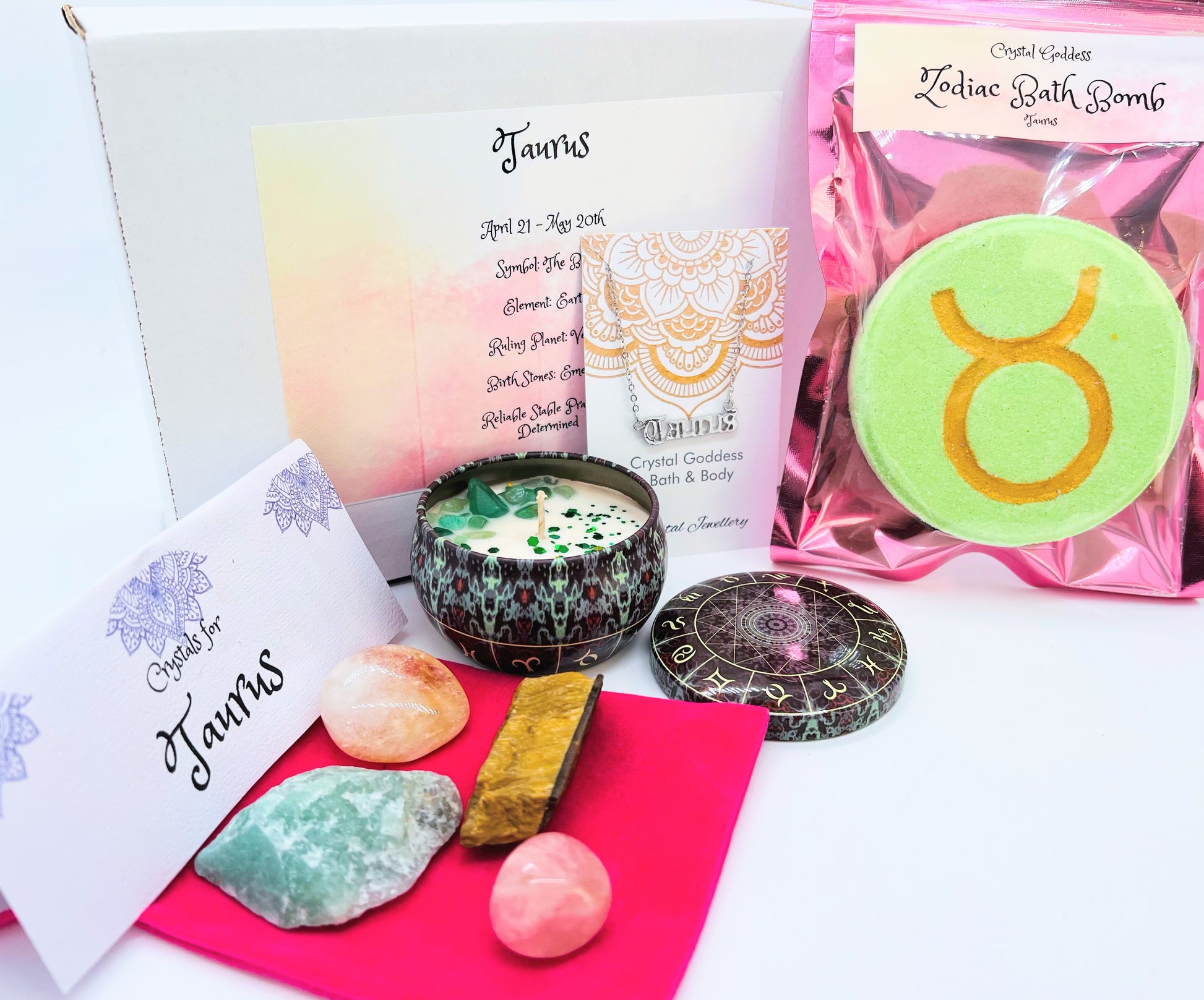 Taurus zodiac gift box showing a set of four crystals, crystal candle, pendant and a bath bomb with the symbol for this sign on it.