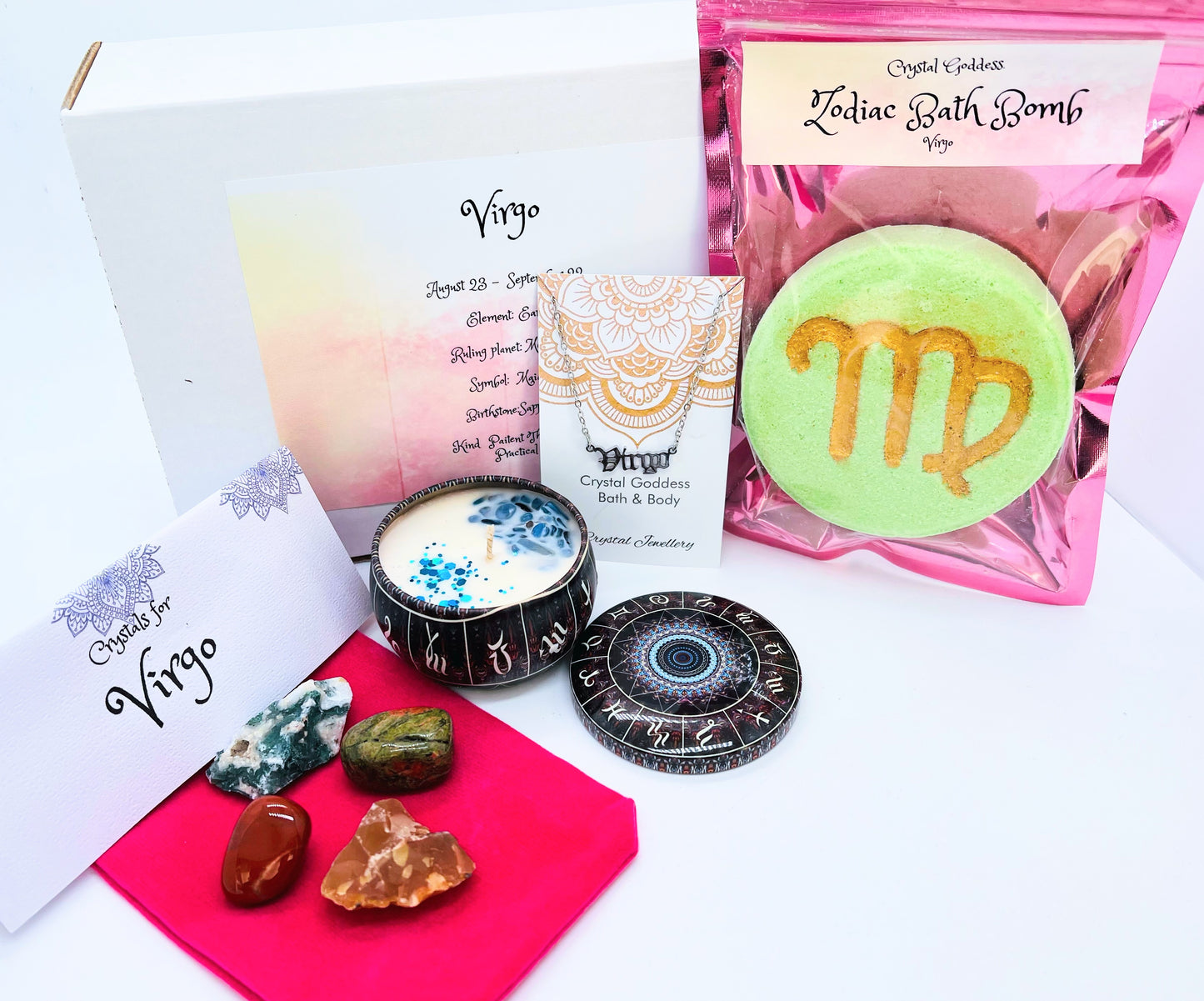 Virgo zodiac gift box showing a set of four crystals, crystal candle, pendant and a bath bomb with the symbol for this sign on it.