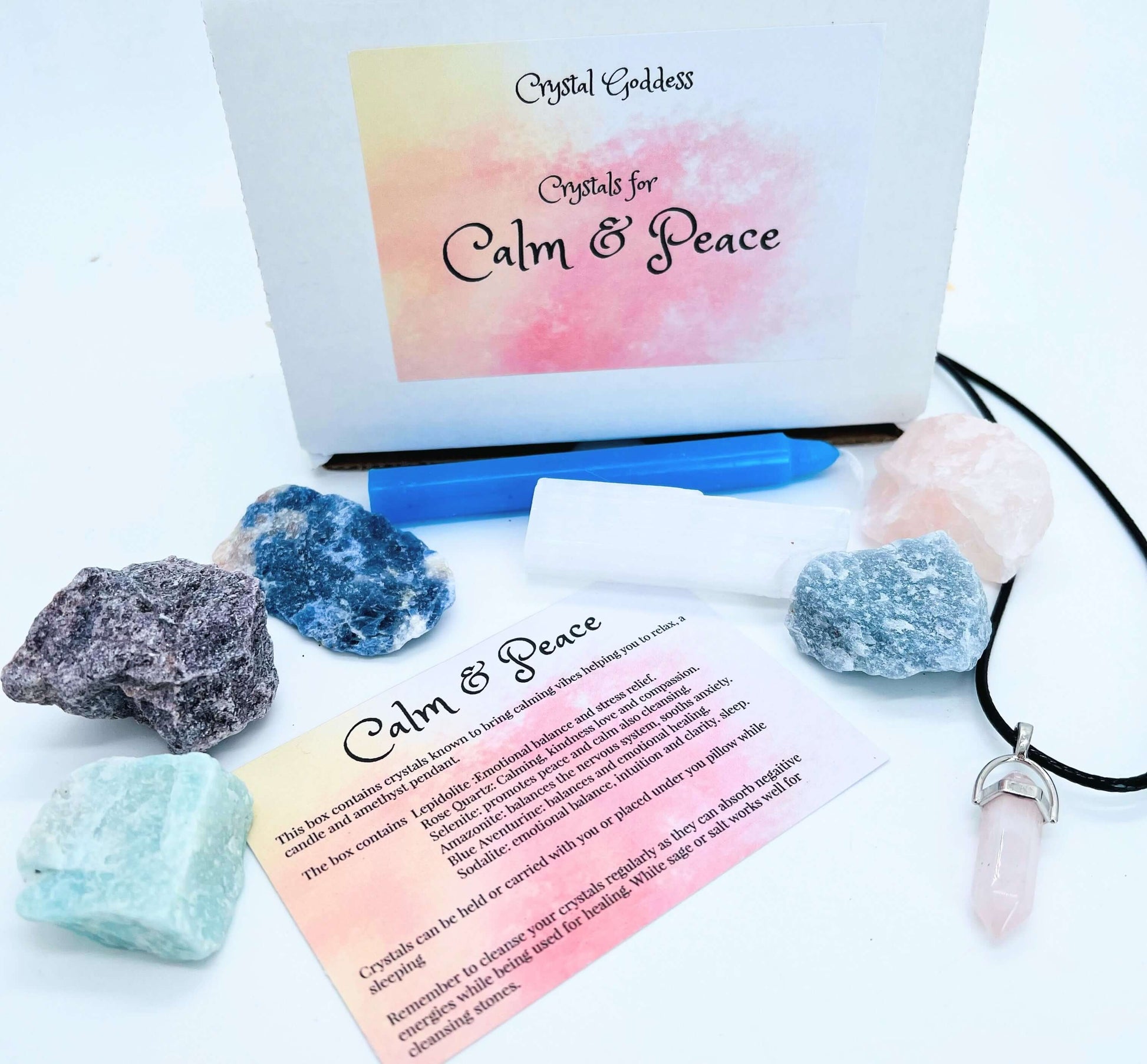 Gift box with crystals and information card on white background 