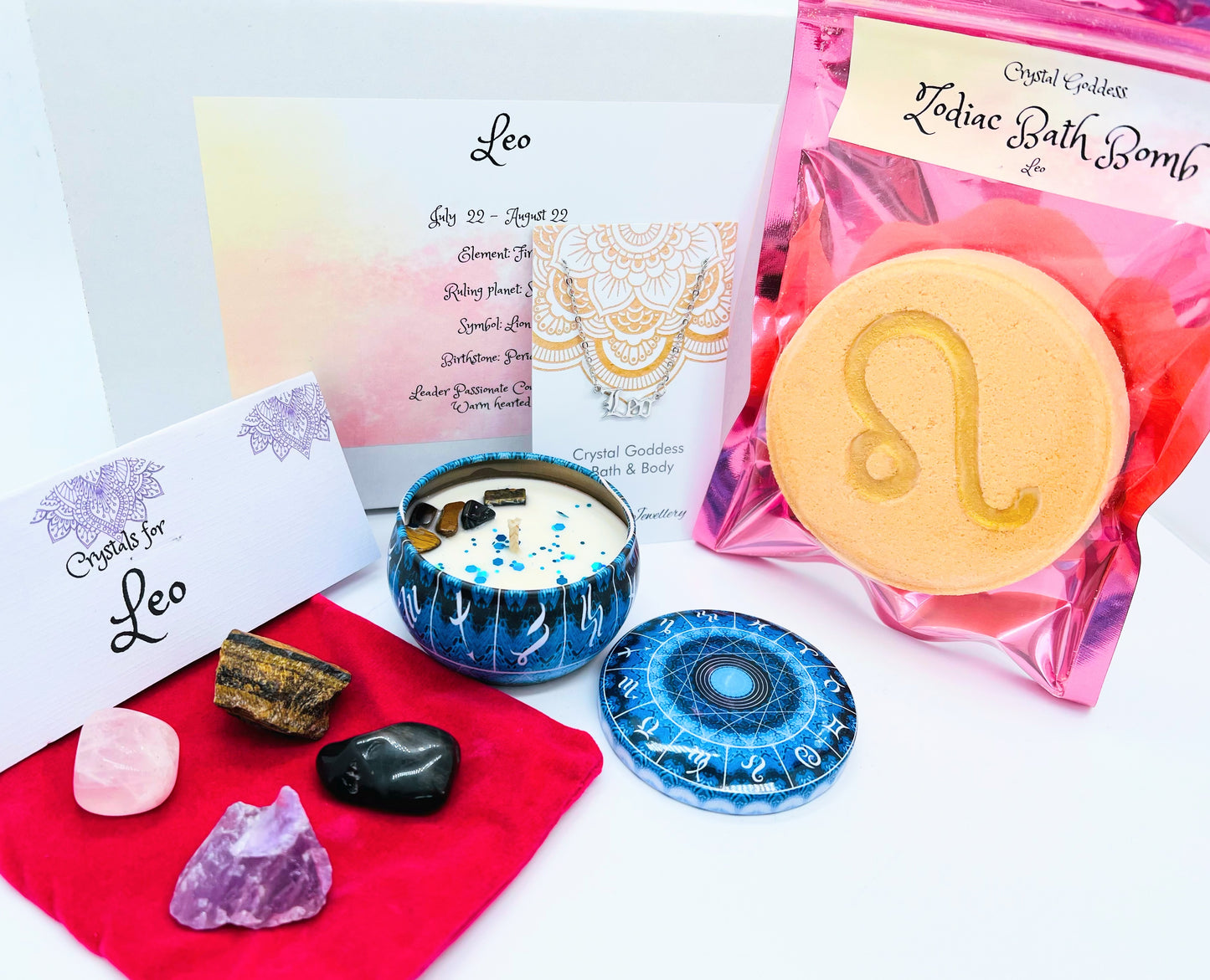Leo zodiac gift box showing a set of four crystals, crystal candle, pendant and a bath bomb with the symbol for this sign on it.